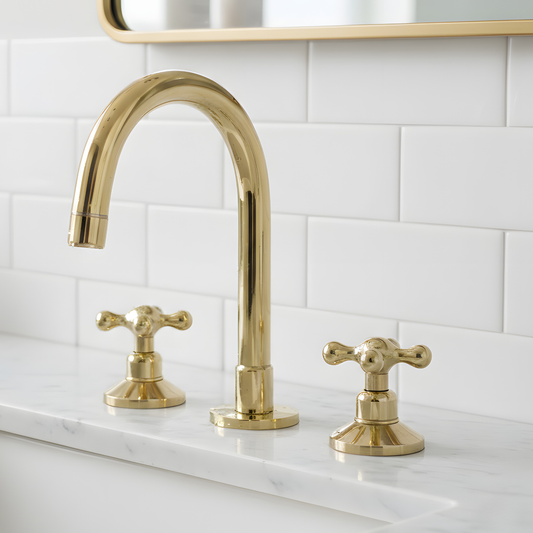 Grand Arc unlacquered brass widespread bathroom faucet with cross handles