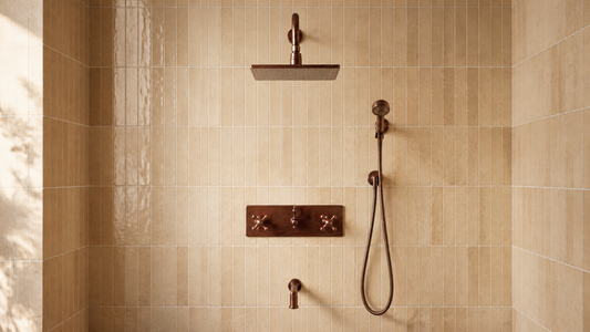 Antique copper three-function shower system with rain head, handheld shower, tub filler, and control trim